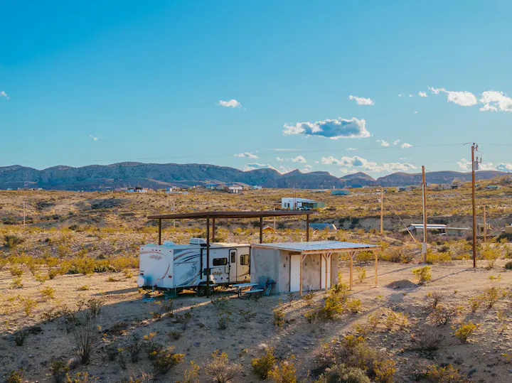 A trailer park with a lot of trees in the background